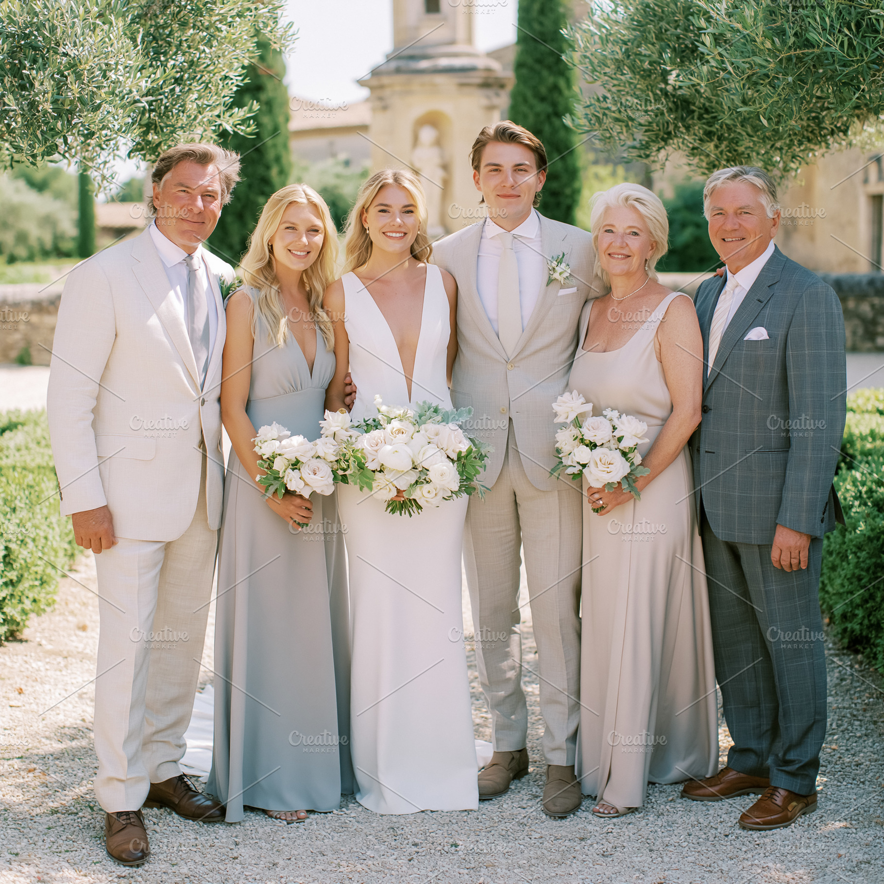 Wedding party celebrating outdoors, bride and groom with parents, a Person Photo by Studio ANNA