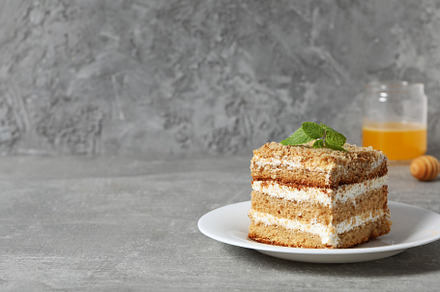 Concept of sweets, honey cake, space for text, a Food & Drink Photo by AtlasStudio