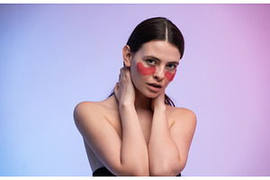 Woman applying eye patches for skin, a Health & Medical Photo by volodymyrshtun13795
