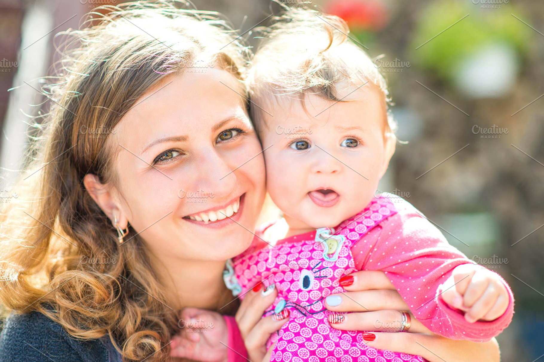 Beautiful mother and baby outdoors stock photo containing happy and playing, a Person Photo by okskukuruza