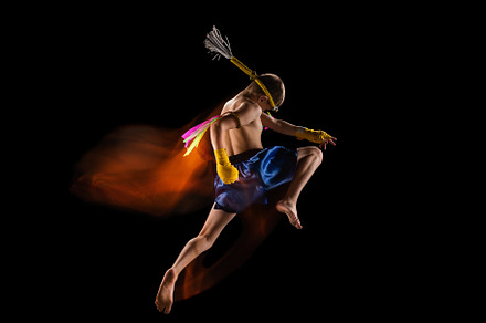 Little boy exercising thai boxing on black background. Fighter practicing, trai, a Sports & Recreation Photo by Volodymyr Melnyk