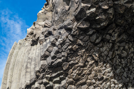 Basalt rock pillars columns at Reynisfjara beach near Vik, South, a Background Photo by YuriyB