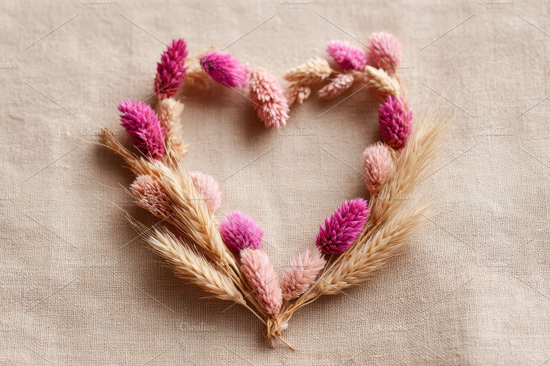Heart made of dried flowers on fabric, a Holiday Photo by AlyaAnd