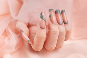 Female hand showing long square marble design nails, a Beauty & Fashion Photo by Olena Rudo