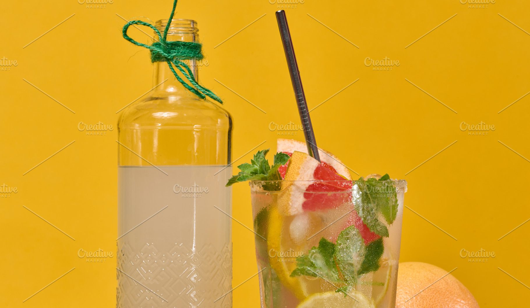 Glass bottle with homemade lemonade and a glass with a cold cock, a Food & Drink Photo by ndanko
