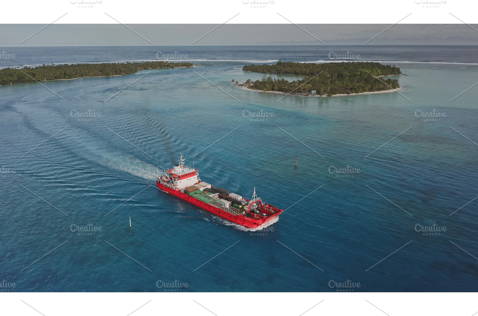 Red cargo ship sailing near tropical, a Transportation Photo by Goinyk