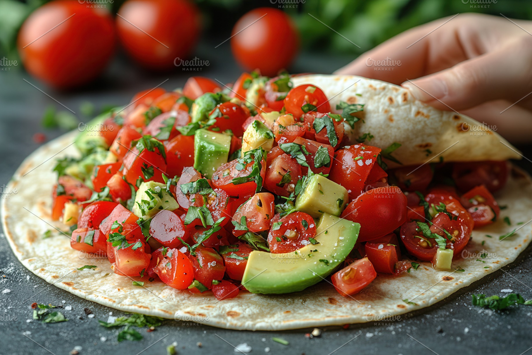 Fresh tomato and avocado salad wrapp, a Photo by Tanuart