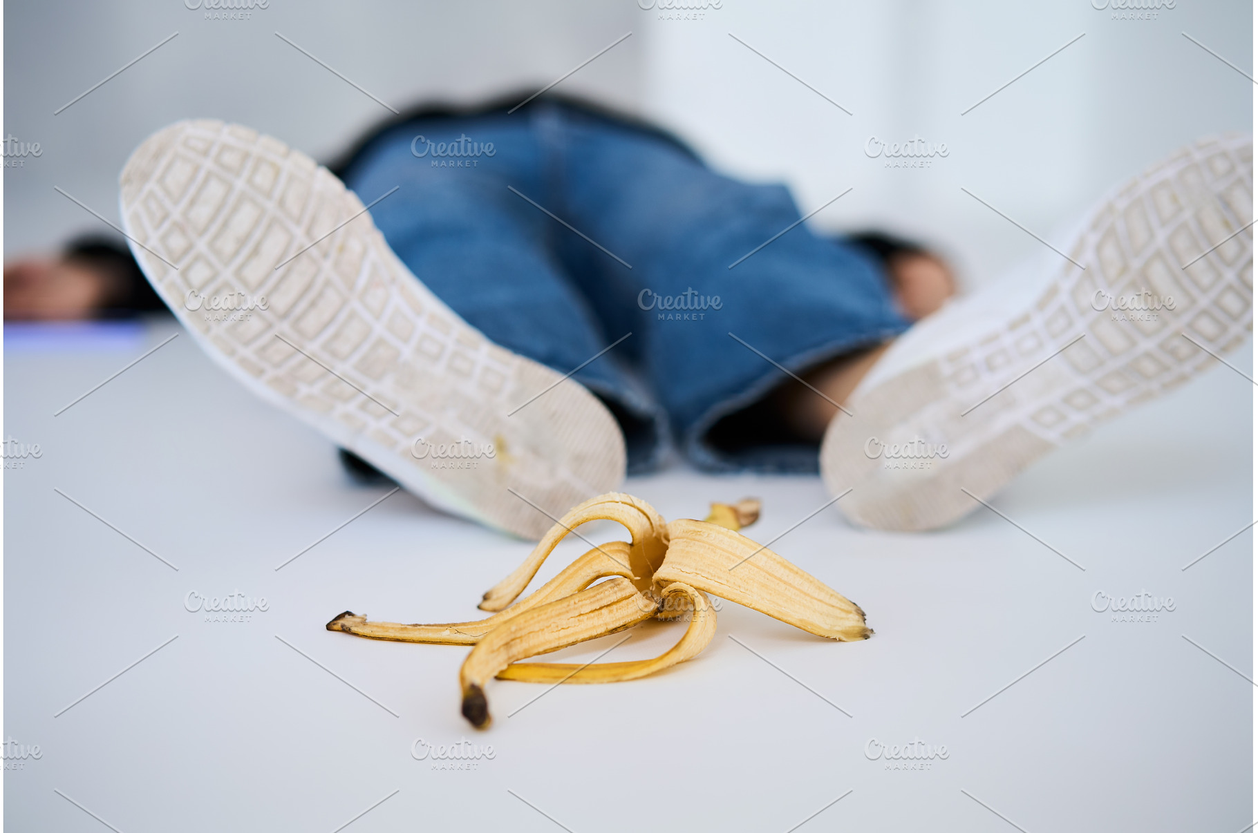 Person slips and falls on banana, an Industrial Photo by Gladkov photography