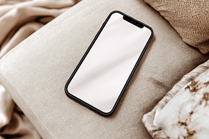 Smartphone resting on a soft surface, a Photo by Beautiful things