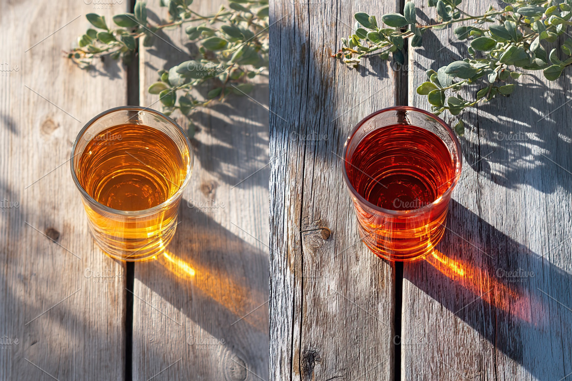 Comparison of two glass cups with liquid under different lighting on a wooden t, a Food & Drink Photo by AlyaAnd