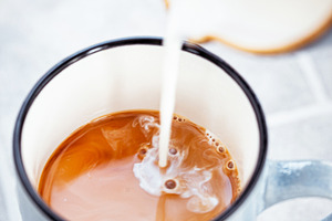 Hot black americano coffee and milk, a Food & Drink Photo by Kate S