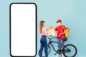 Delivery Man Near Smartphone Giving Shopper Bags To Lady, Studio, a Photo by Prostock-Studio