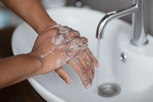 Handwashing concept. Young indian man washing hands with antibacterial soap und, a Person Photo by Prostock-Studio