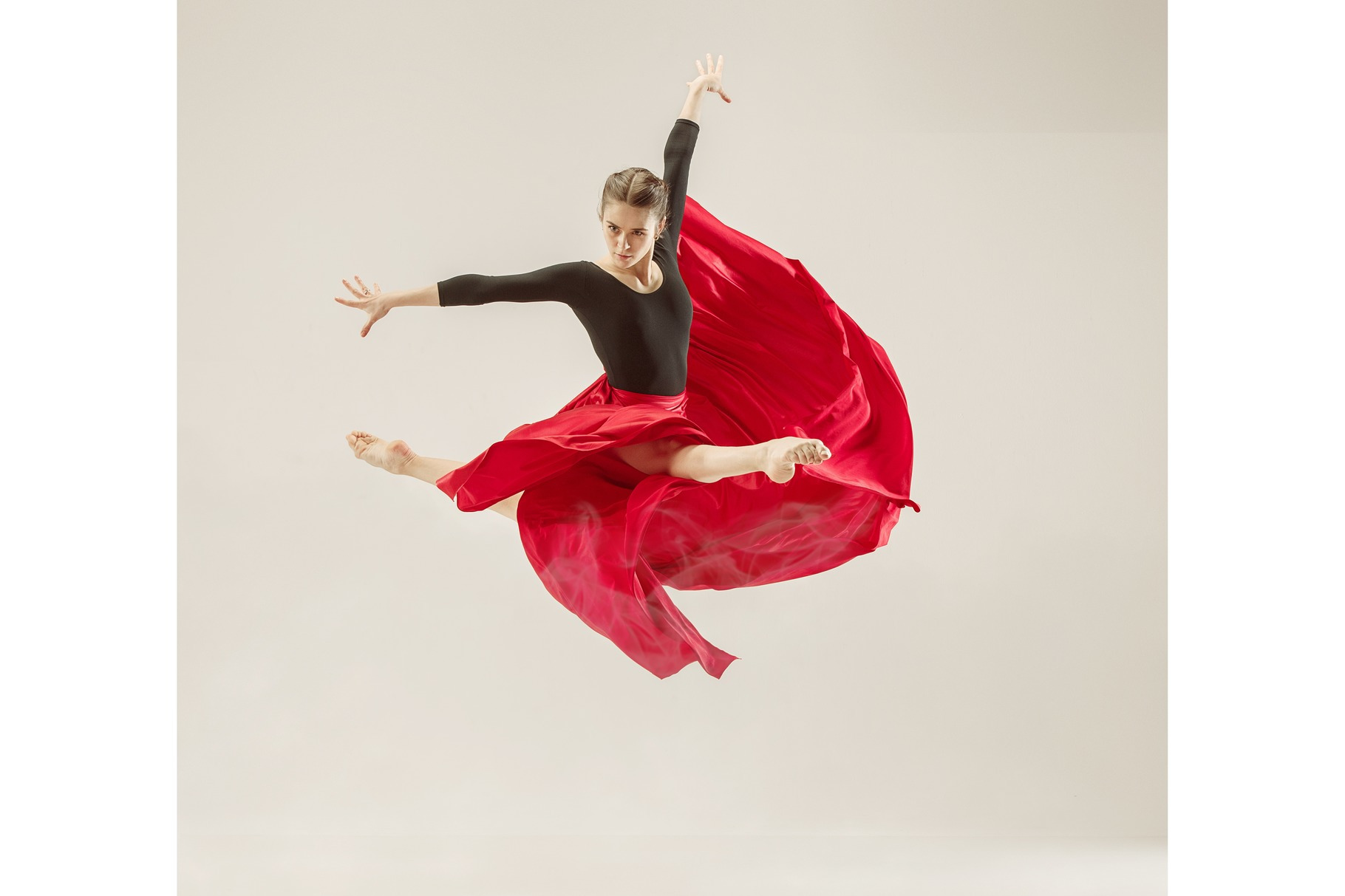 Modern ballet dancer dancing in full body on white studio background, a ...