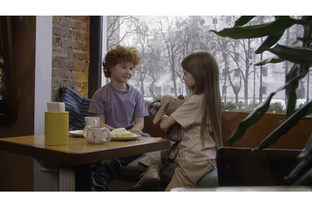 Cute couple of kids in cafe. Stock, a Person Photo by Media Whale Stock