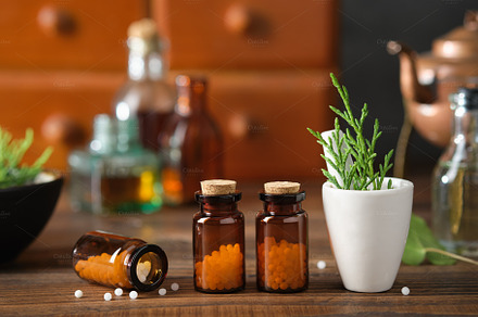 Bottles of homeopathic granules, cabinet with homeopathic remedi, a Photo by chamillewhite