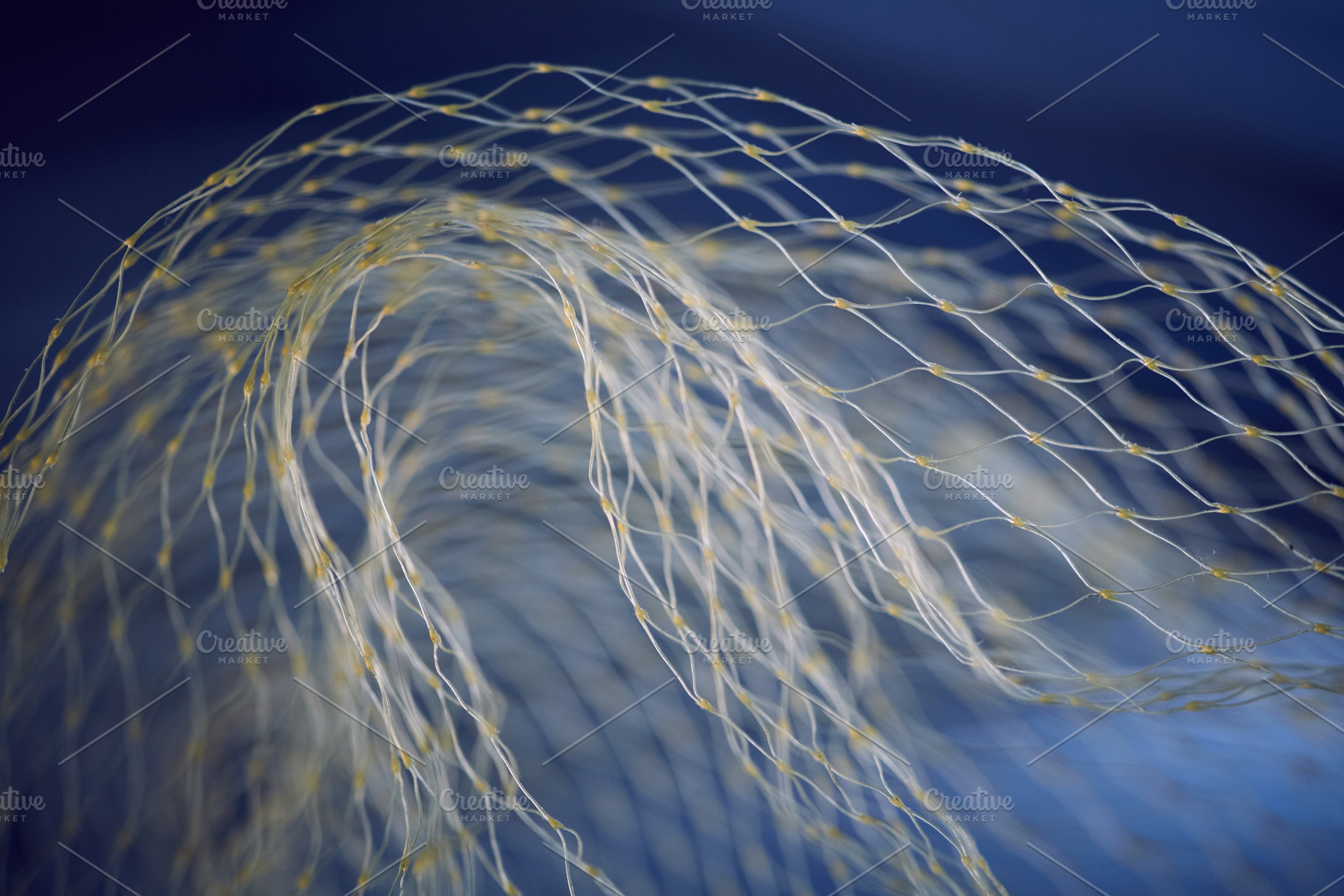 Abstract tunnel effect with yellow nylon mesh on dark blue background. Curved s, an Abstract Photo by Rohan Photography
