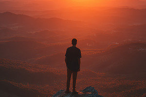 Man Silhouetted Against Vibrant Suns, a Photo by Pixeness Studio