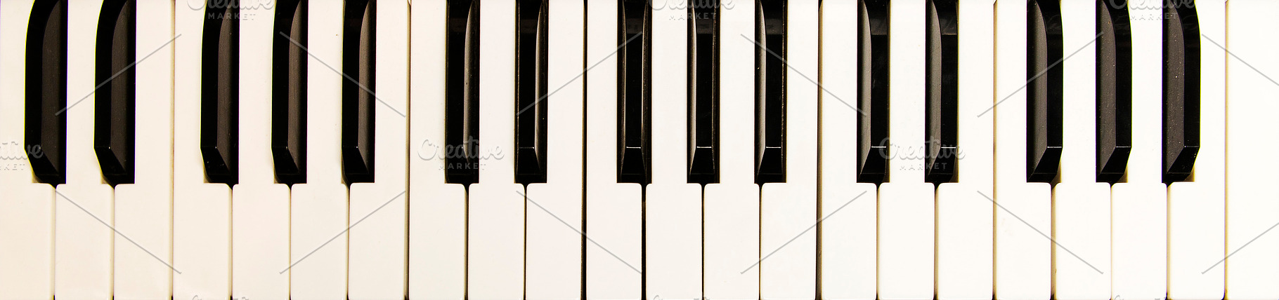 Piano keys close-up, a Photo by Floor