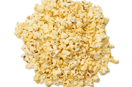 Heap of fried popcorn with cheese isolated on white background, a Food & Drink Photo by ndanko