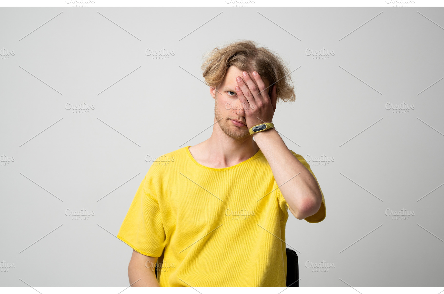 Young man wearing a yellow t-shirt, a Person Photo by volodymyrshtun13795