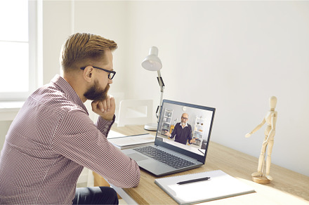 Serious man watching video lecture, a School & Education Photo by StudioRomantic