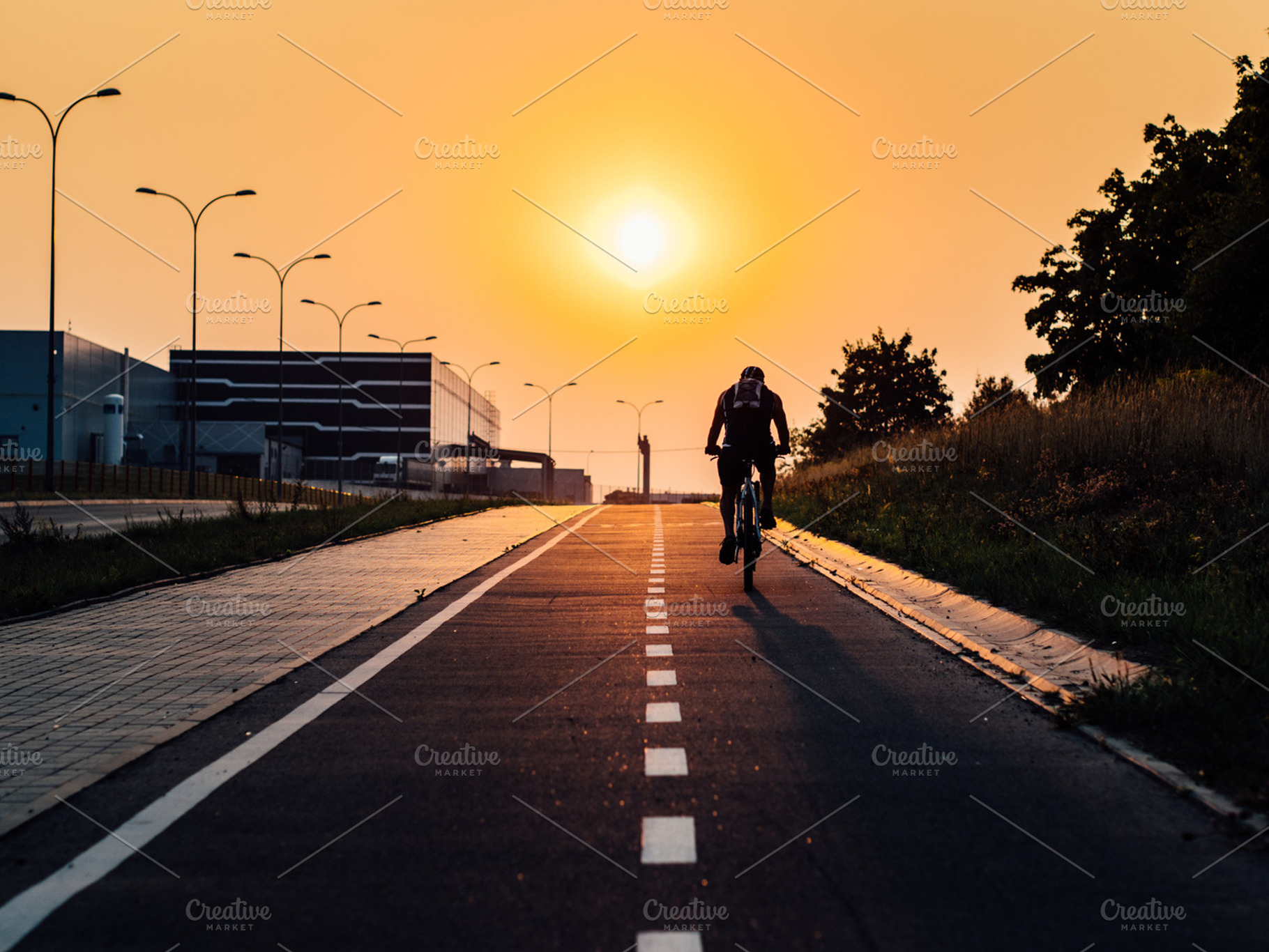 Bicycle path during sunset stock photo containing bicycle and bicycle path, a Sports & Recreation Photo by Pawel Kadysz
