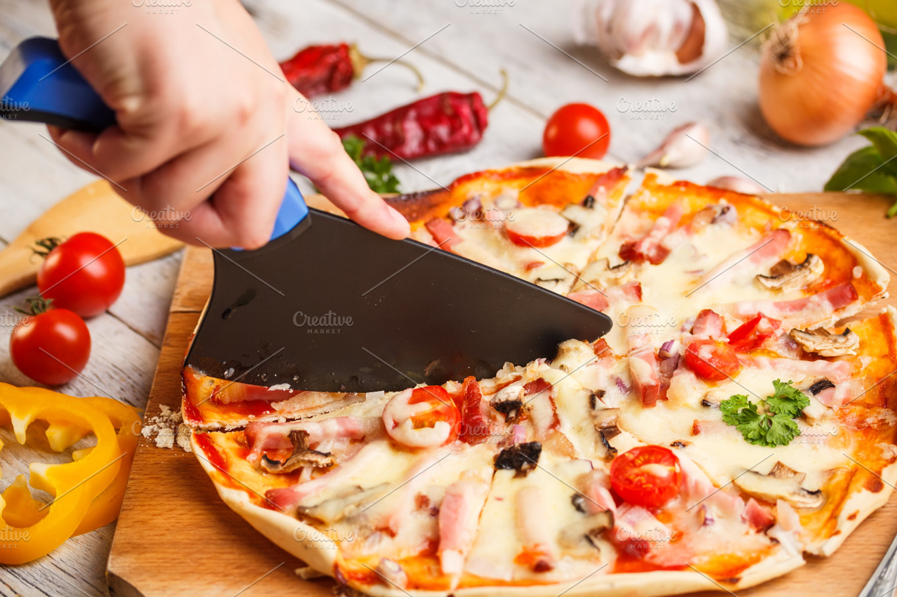Cutter Cuts A Fresh Pizza