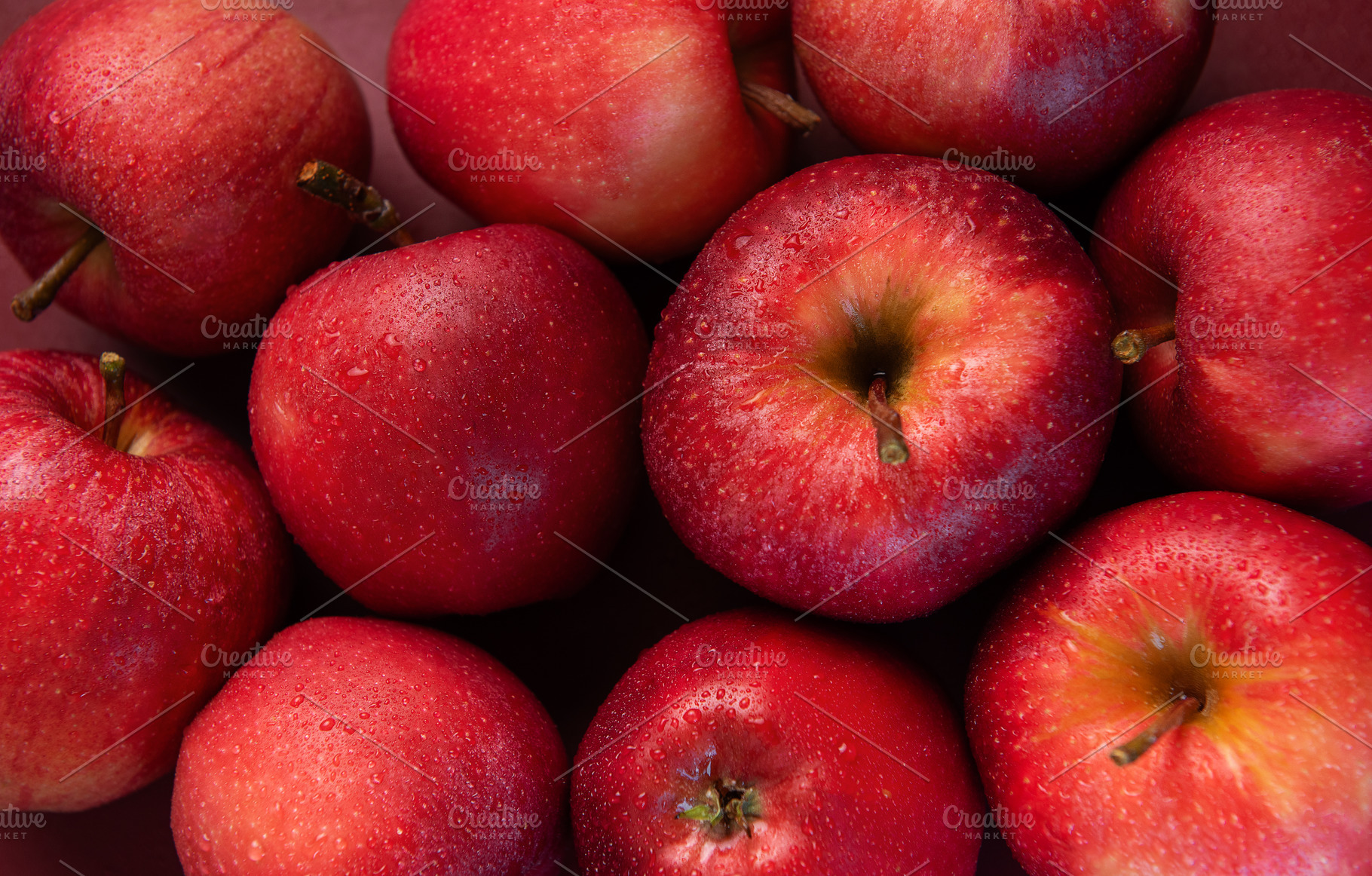 Fresh red apples forming appealing composition on dark backgroun, a Food & Drink Photo by Olena Rudo