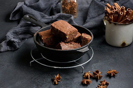 Pieces of baked brownie in a metal black frying pan on the table, a Food & Drink Photo by ndanko