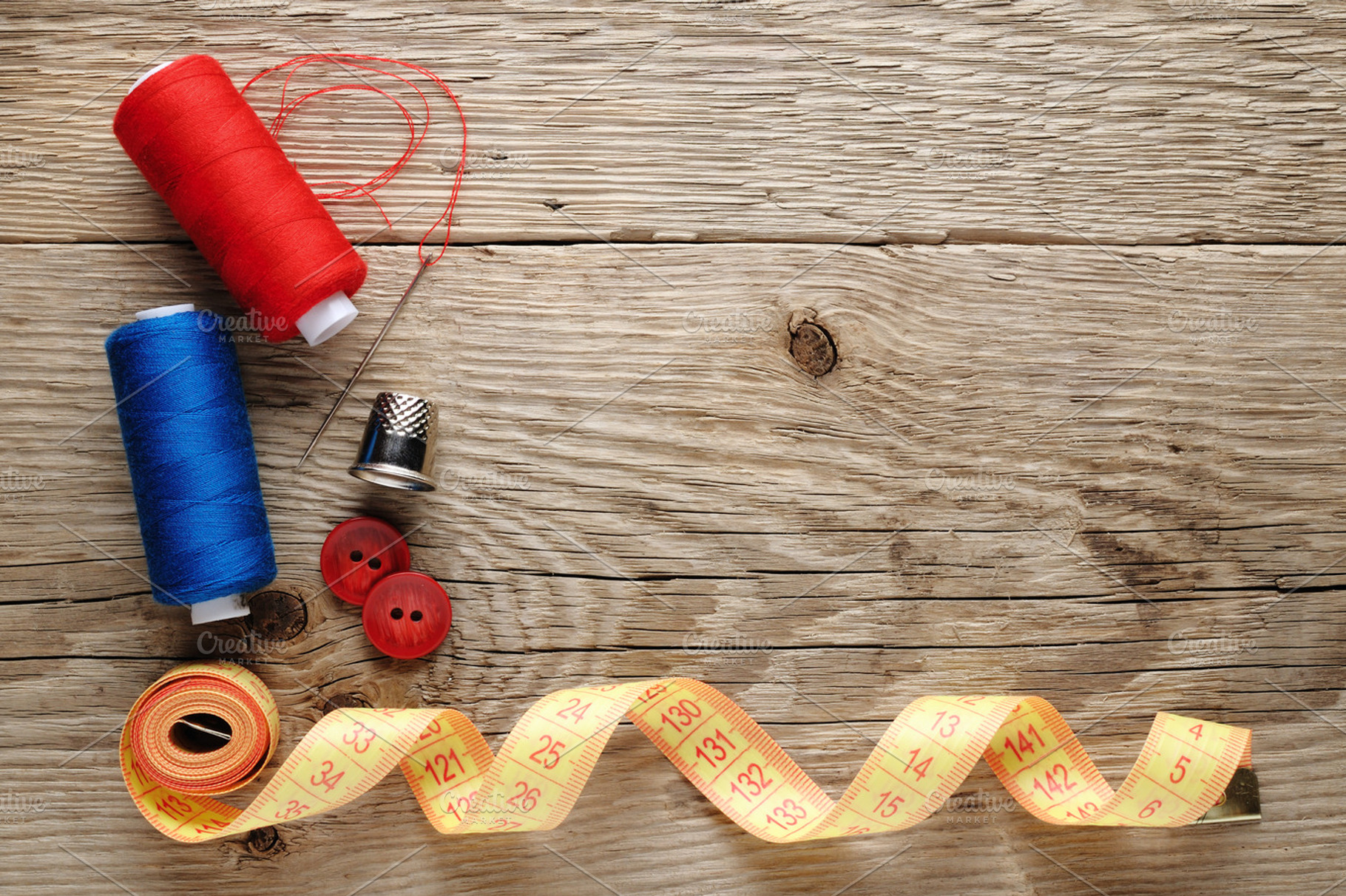 Sewing accessories on wood featuring haberdashery, industry, and instrument