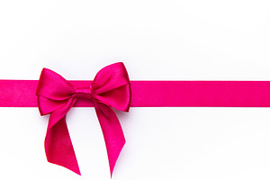 Pink satin ribbon bow gift wrapping decoration, a Photo by Olena Rudo