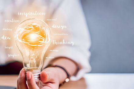 Hand holding light bulb with innovat featuring creative, concept, and idea