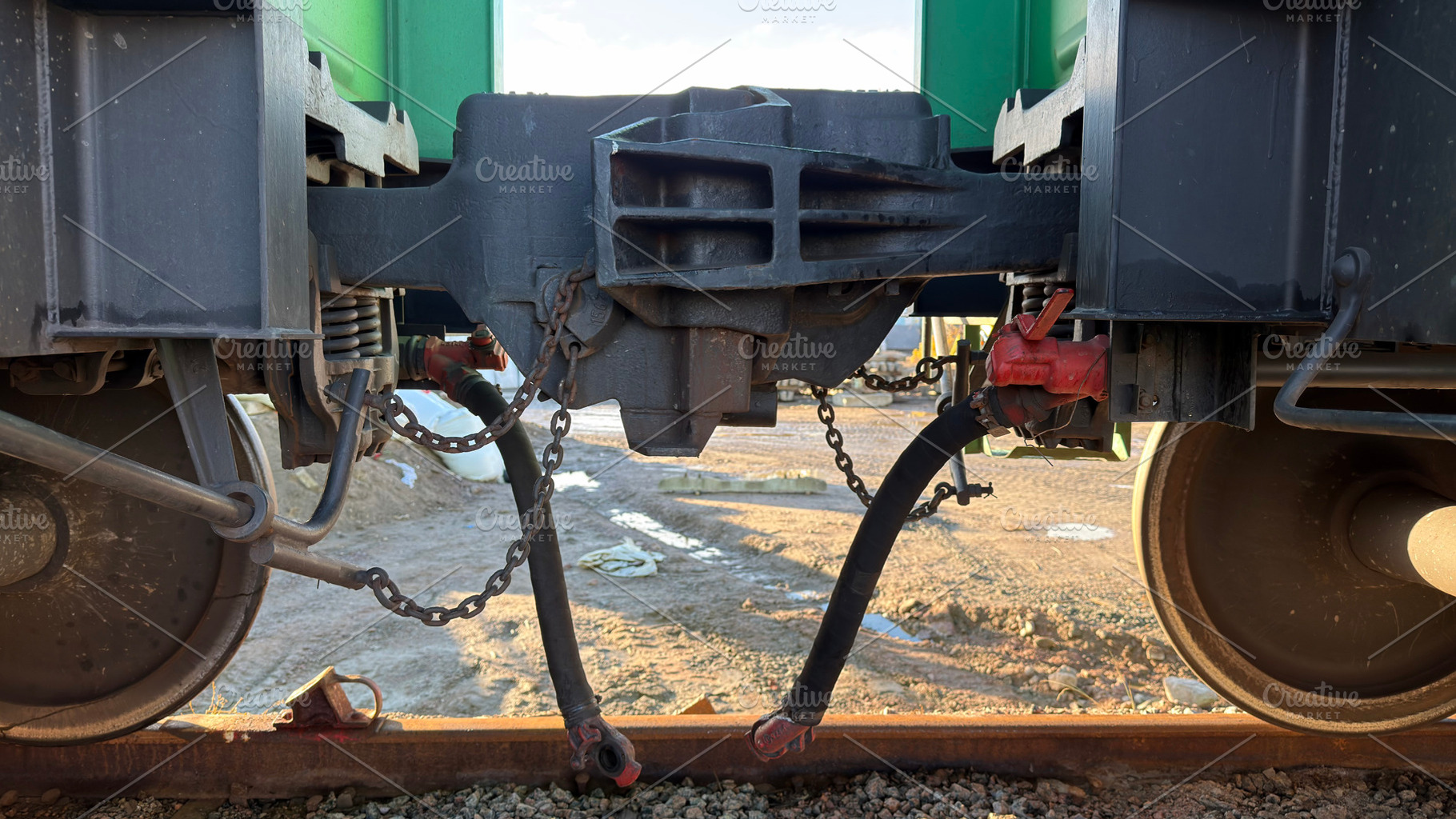 Close-up view of train couplings and wheels, showcasing mechanical components a, an Industrial Photo by Textures & Backgrounds