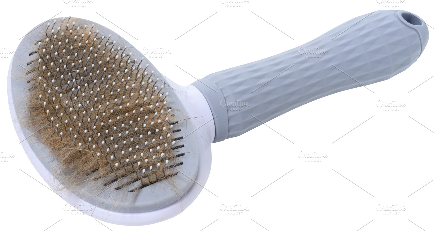 Pet brush for combing hair of cats or dogs with gray body and ha, an Animal Photo by ndanko