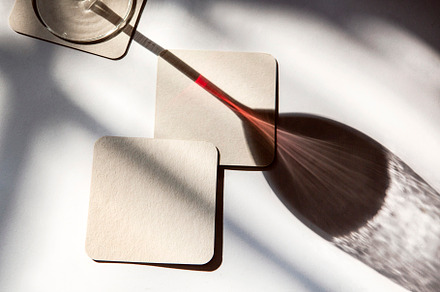shadow of a glass of red wine, a Photo by UN-BRANDED
