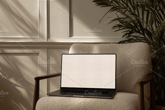 white laptop display on sofa preview 2