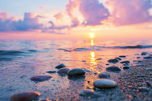 Variety of smooth polished stones near the water, a Nature Photo by AlyaAnd