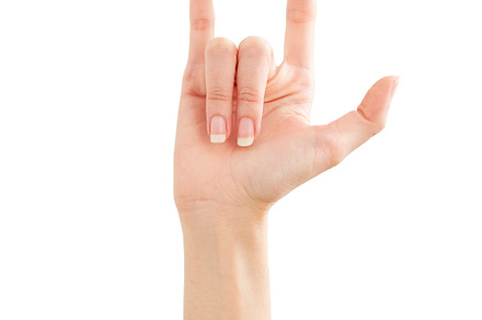 Woman hand showing peace love on whi, a Background Photo by 1981 Rustic studio kan