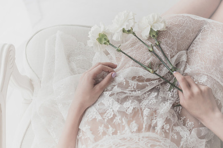 Flowers lie on the lap of a girl featuring flower, background, and woman, a Beauty & Fashion Photo by Elena Vagengeim