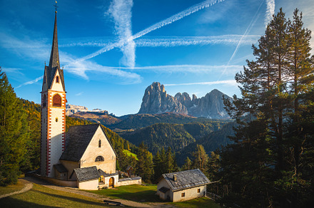 St Jakob church in the autumn forest, an Architecture Photo by Alpine Dreams