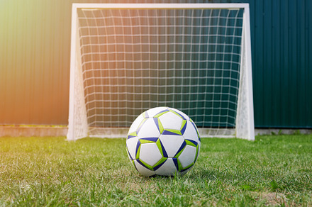 Football ball on green grass, a Sports & Recreation Photo by PixieMe