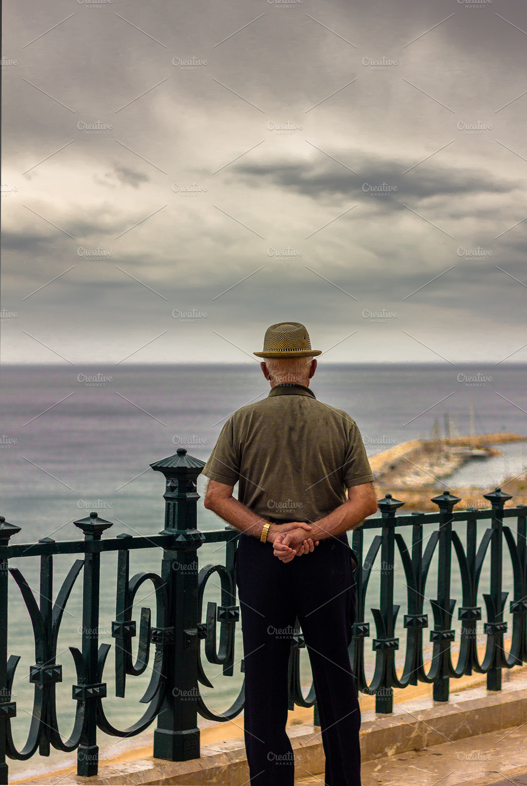 Older man looking out to sea, a Person Photo by JCB Photogr@phics
