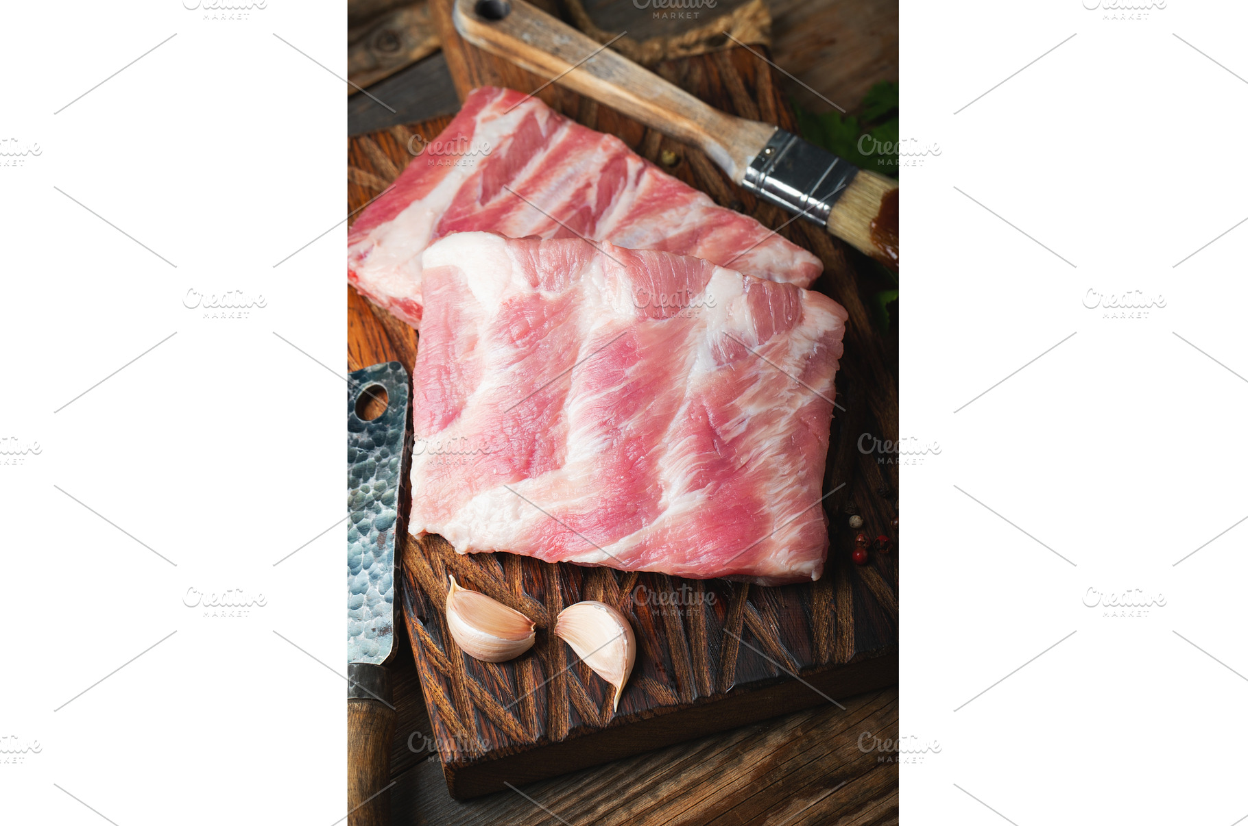 Raw pork ribs with spices, salt and, a Food & Drink Photo by Budarinphoto