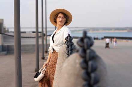 Woman thoughtfully posing with straw