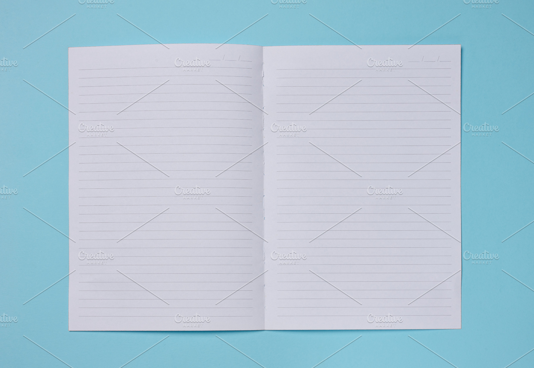 Spread of a clean lined notebook on a turquoise background., a Background Photo by ndanko