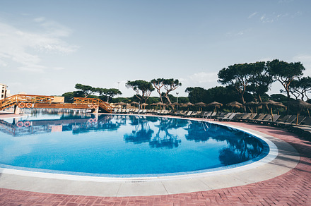 Circular pool with wooden bridge, a Sports & Recreation Photo by SkyNext