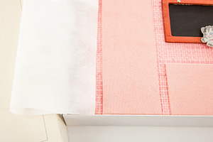 Pink photo album with protective sheet and small blackboard inside its box, an Abstract Photo by Antonio Gravante Market