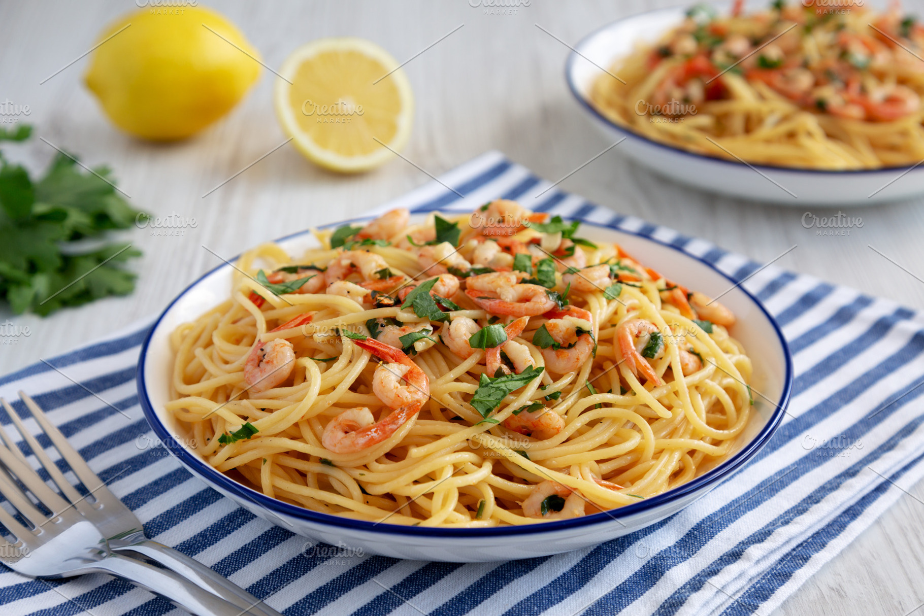 Homemade Garlic Shrimp Scampi with Parsley on a Plate, low angle, a Food & Drink Photo by LiudmylaChuhunova