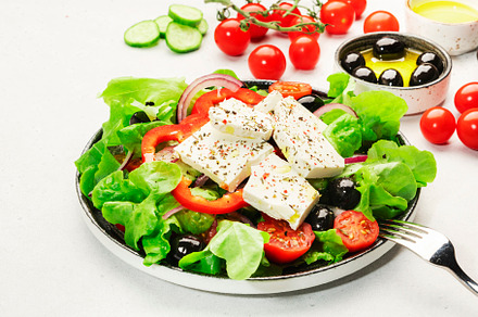 Greek salad with feta cheese, olives, cherry tomato, paprika, cu, a Food & Drink Photo by 5PH